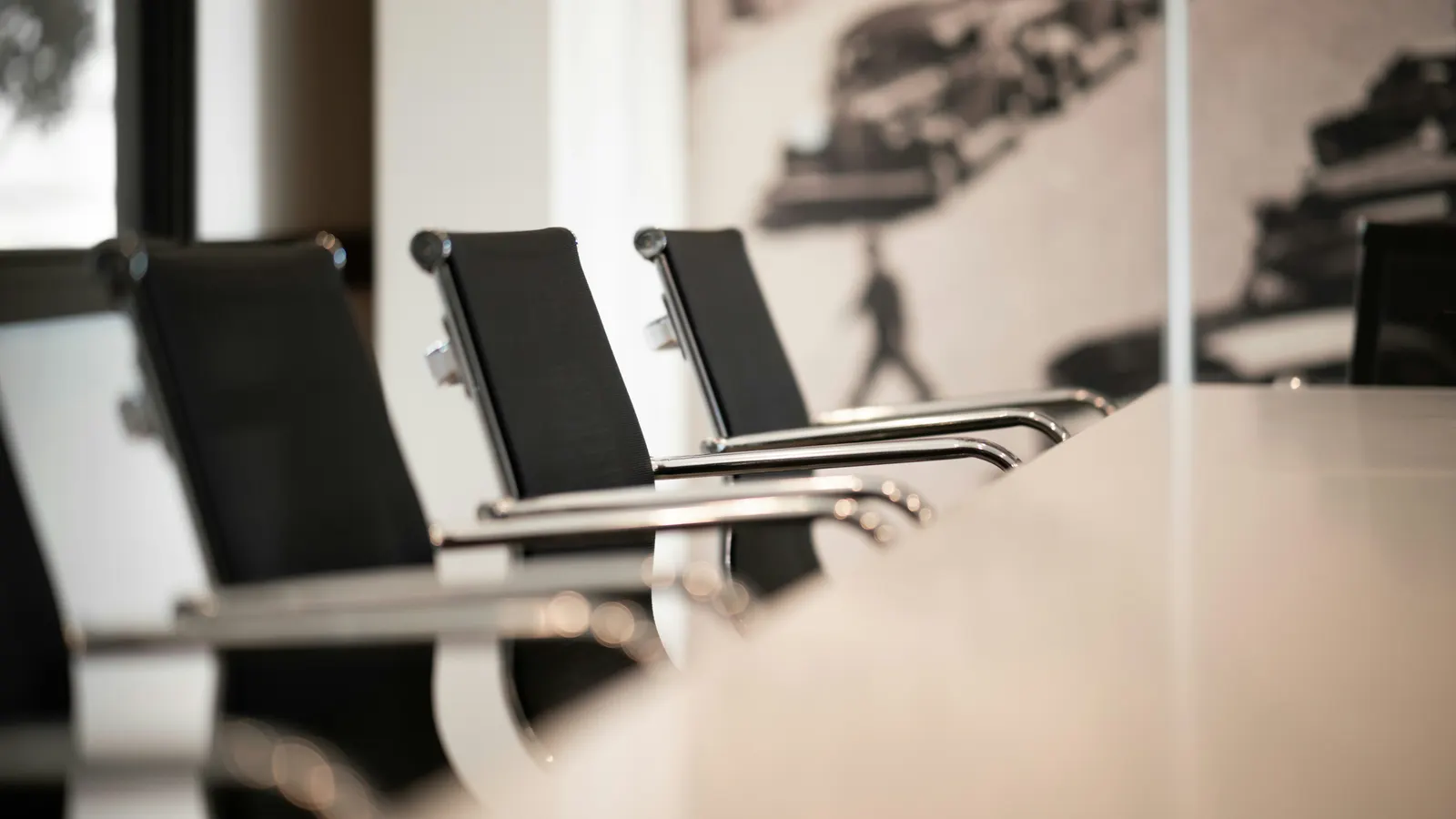 Black leather chairs at a conference table