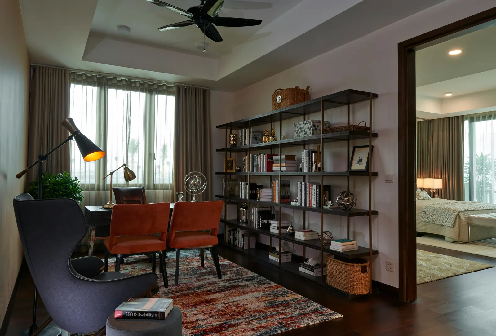 A study with bookshelves and an armchair