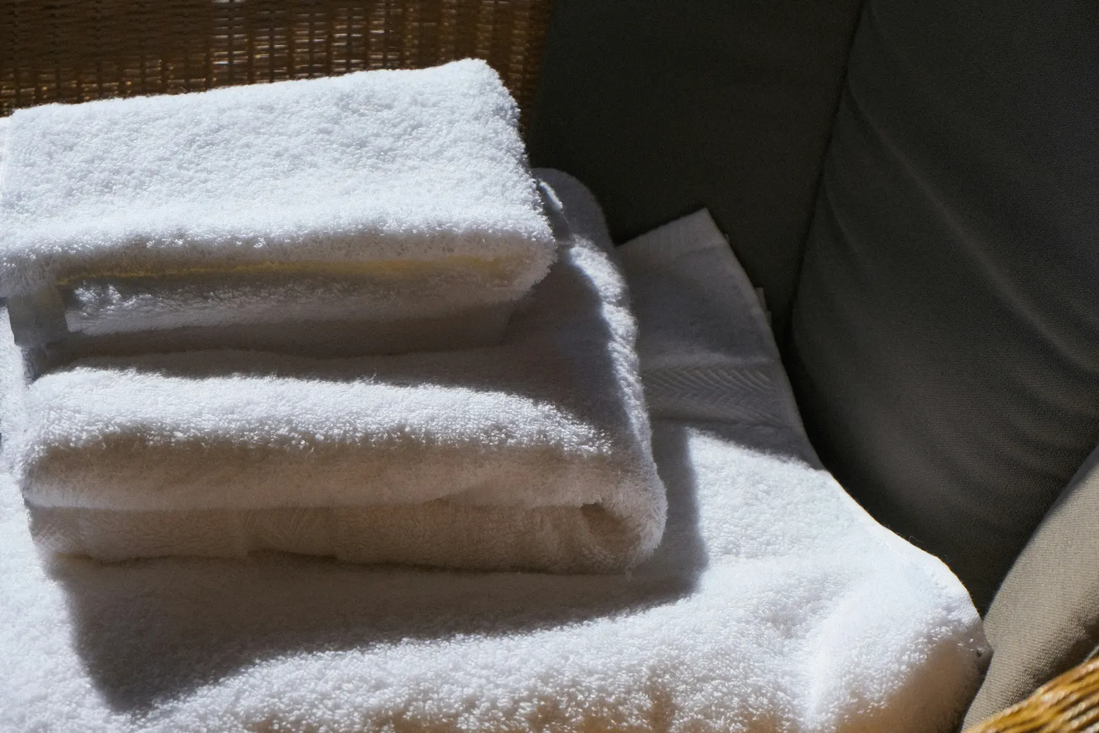 A stack of freshly laundered white towels